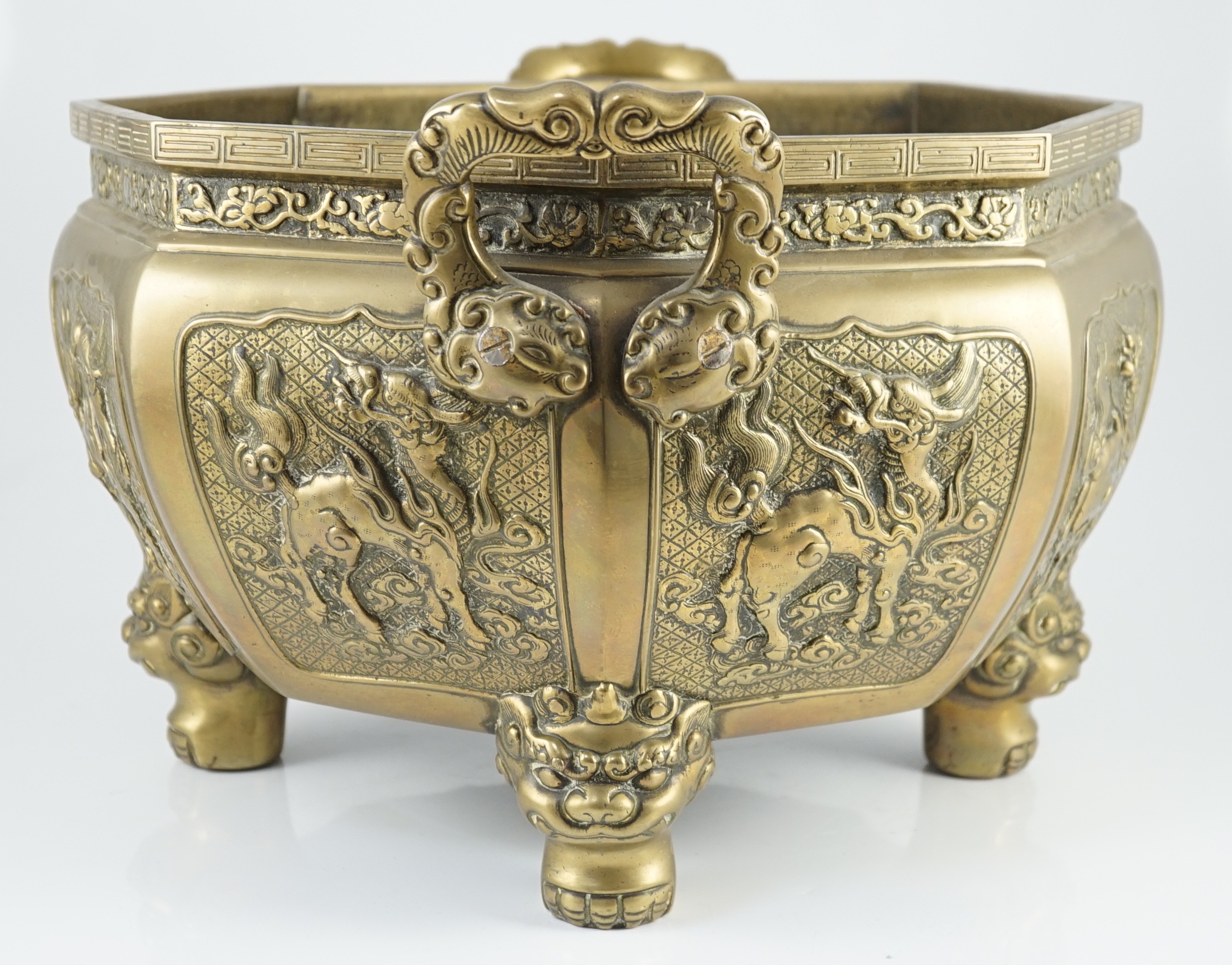 A large Chinese polished bronze octagonal jardiniere, 19th century, 48cm wide at handles, slight faults